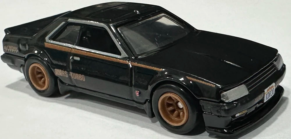 Hot Wheels 2024 - Premium / Boulevard # 94 -  Nissan Skyline RS (KDR30) - Black - Metal/Metal & Real Riders